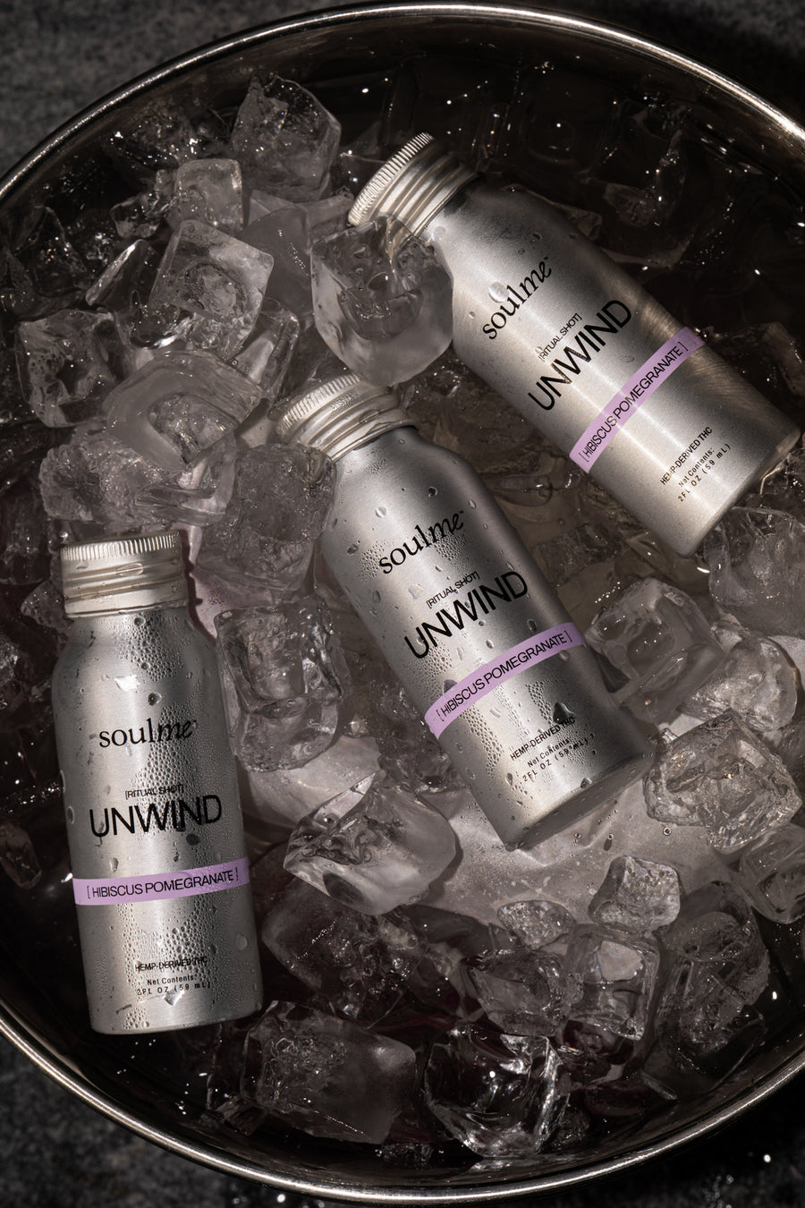 Three Unwind Ritual Shots in an ice bucket