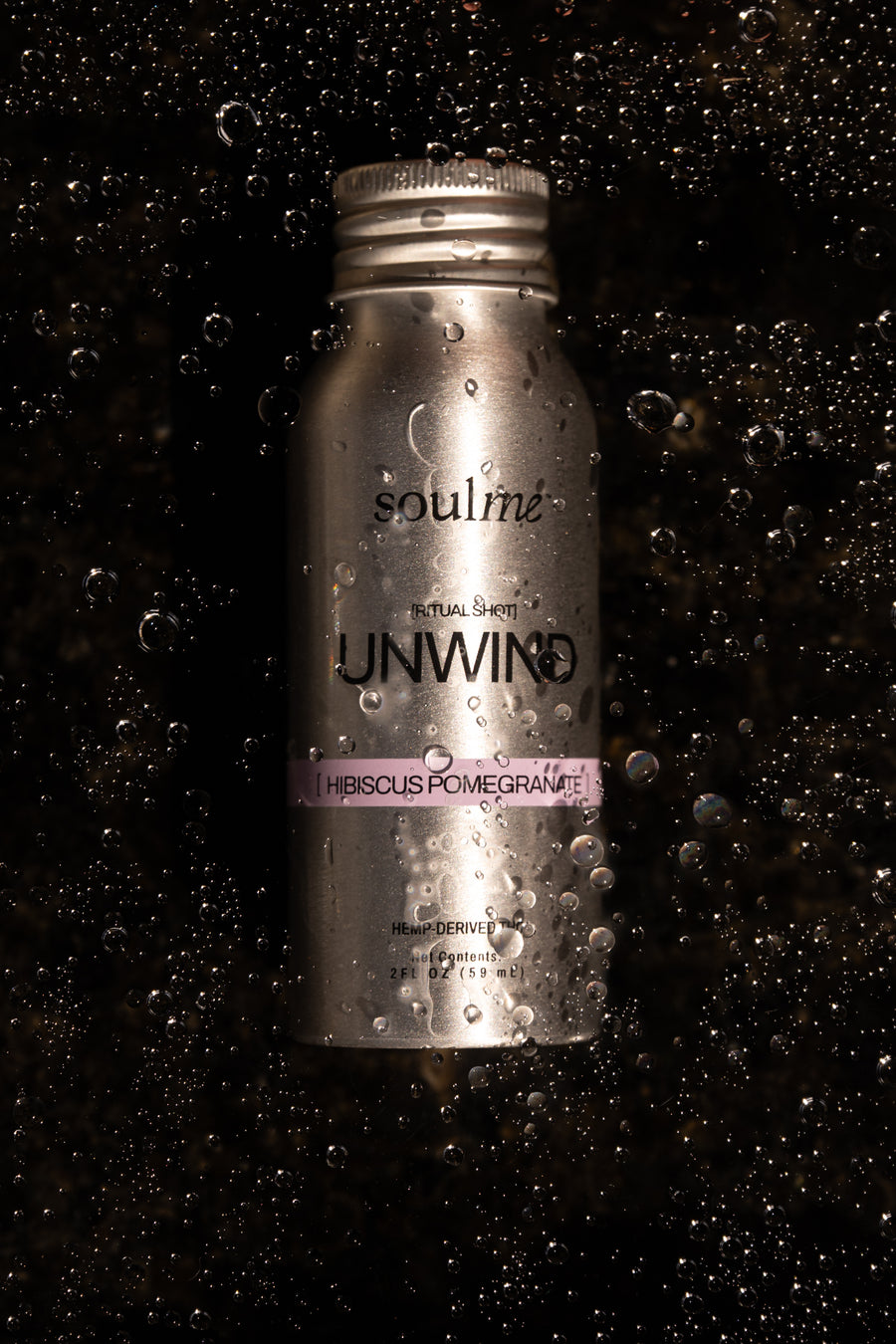 SoulMe Unwind Ritual Shot covered in condensation on a dark background